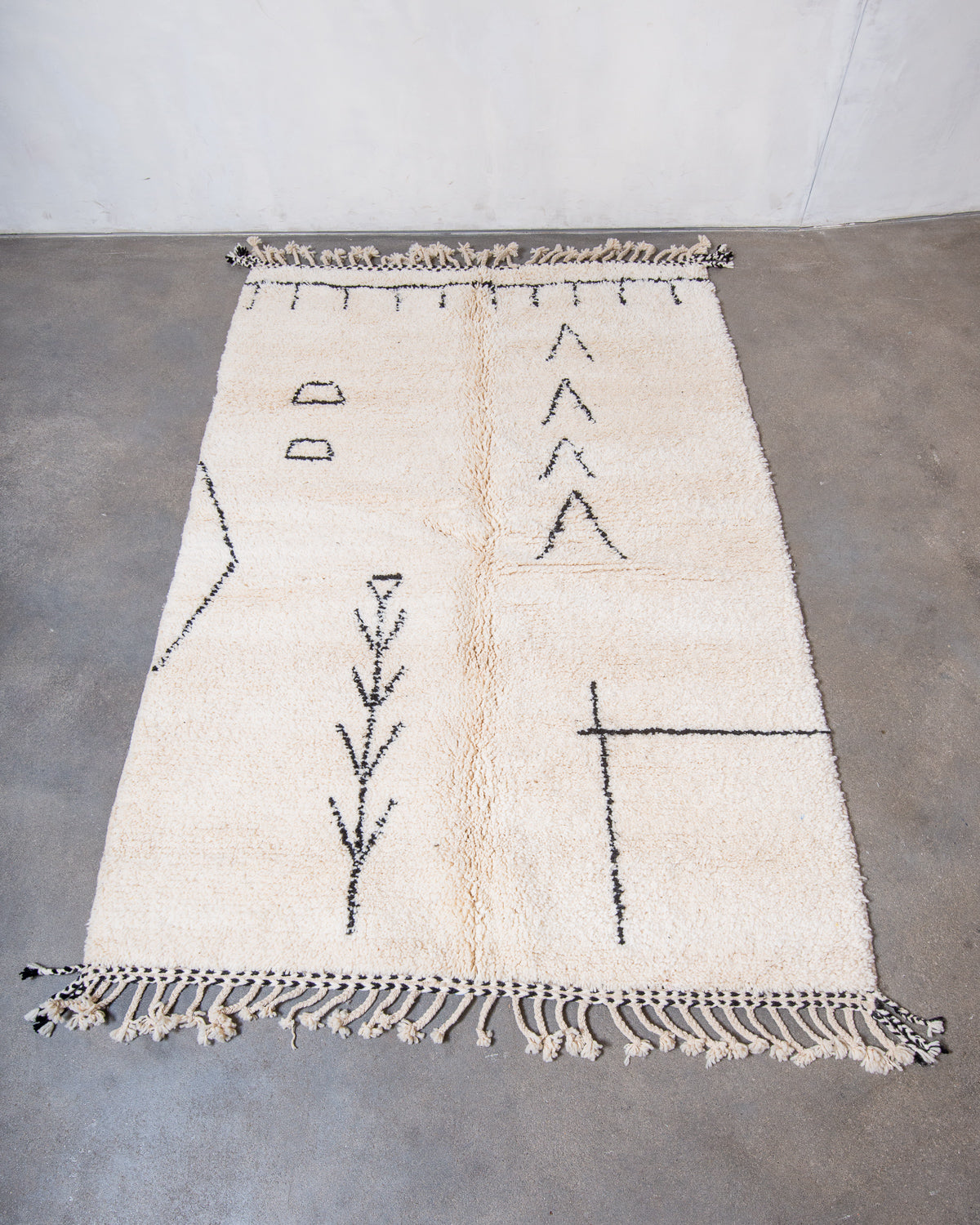 Modern, designer, handcrafted Berber rug from Morocco. Beniourain carpet with minimalist design, natural wool pile and a fluffy texture.